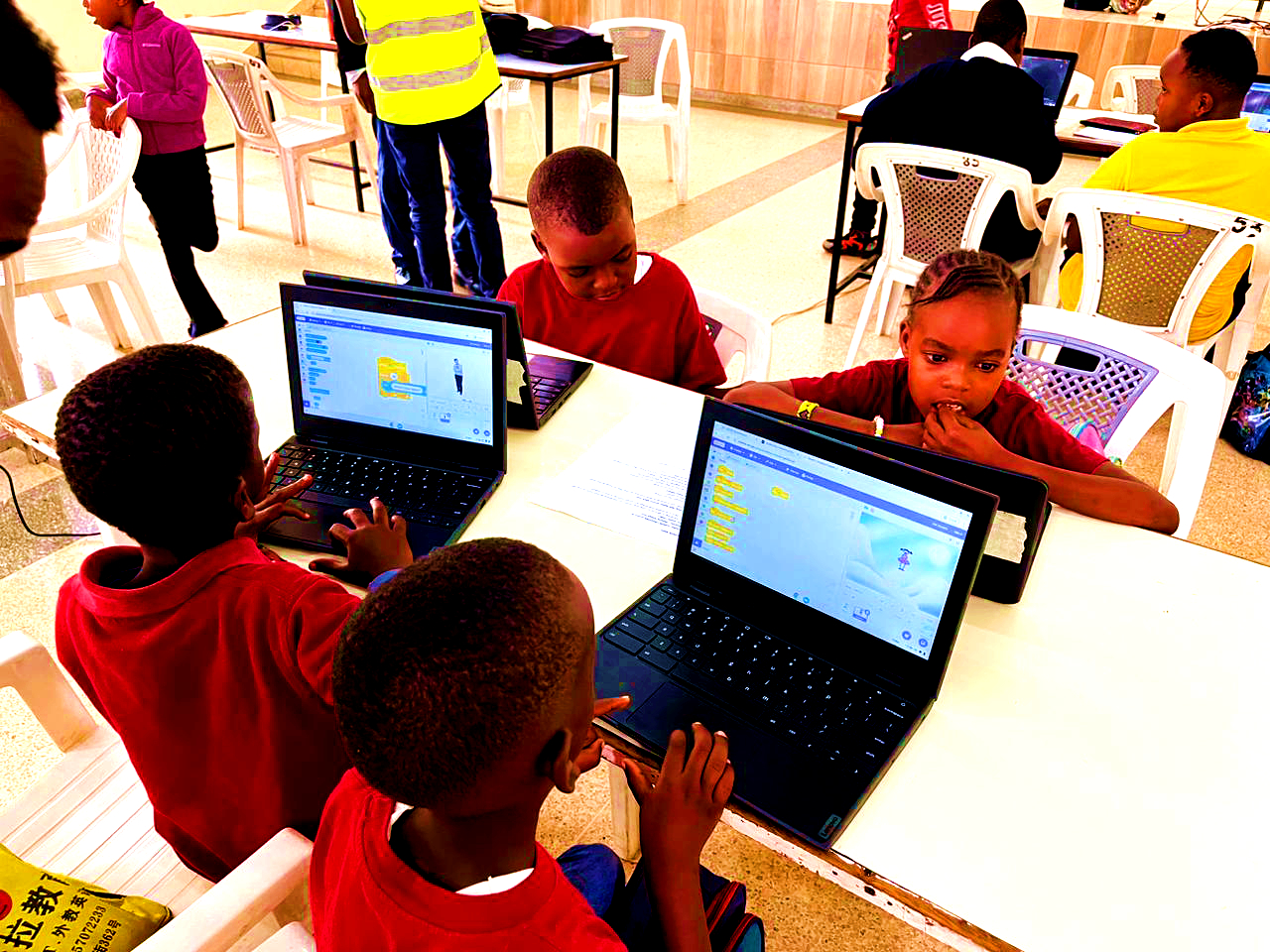Learners coding during the tournament